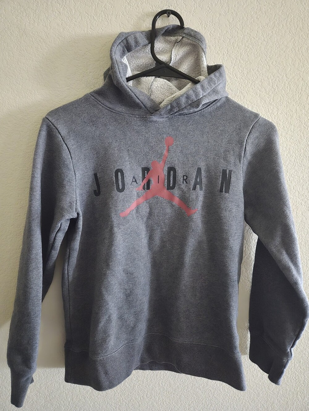 Jordan Grey Hoodie with Red Jumpman and Black Lettering. Youth Med.